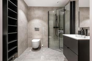 Ένα μπάνιο στο Moderne 2 - Roms Leilighet i Vannkunsten Syd +10 φωτογραφίες
