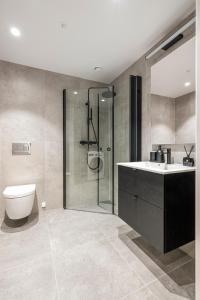 Ένα μπάνιο στο Moderne 2 - Roms Leilighet i Vannkunsten Syd