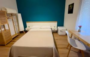 a room with a bed and a table and a desk at Moonlight Drive in Cava deʼ Tirreni