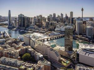 an aerial view of a city with a river and buildings at ibis Sydney Darling Harbour in Sydney