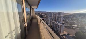a balcony of a building with a view of a city at Departamento Salar in Calama