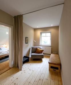 a living room with a couch and a window at Landschule Rhön in Poppenhausen