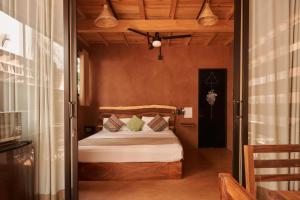 a bedroom with a bed in a room at Punta Navi - Adults only - Boutique hotel in Puerto Escondido +17 photos