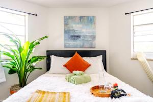 a bedroom with a bed with a tray on it at Short North Convention Private Parking Pets in Columbus