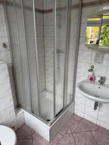 Koupelna v ubytování Hotel Leonis