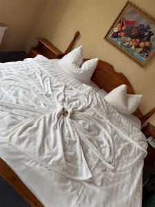 Postel nebo postele na pokoji v ubytování Hotel Leonis