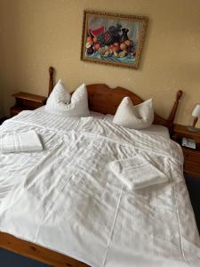 Postel nebo postele na pokoji v ubytování Hotel Leonis