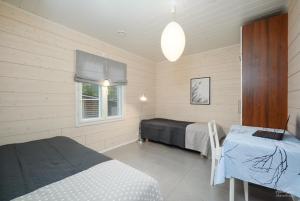 Postel nebo postele na pokoji v ubytování Villa Metsola