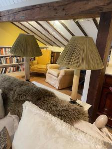 a living room with two lamps and a couch at Bartley Mill in Wadhurst