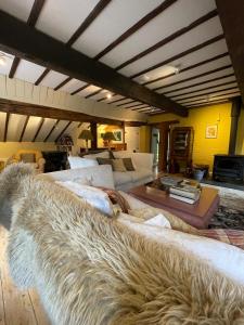 a large large couch in a living room at Bartley Mill in Wadhurst