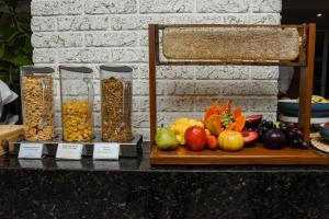 a display of fruits and vegetables on a table at Gran Mareiro Hotel in Fortaleza