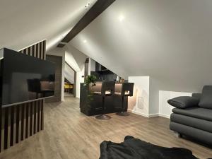 a living room with a couch and a table at 4 Elements Glamping & Apartments in Bled