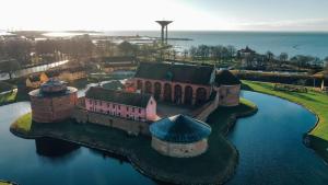 an aerial view of a castle in the water at Sveriges minsta Hotell! Hôtel Gruyère in Landskrona