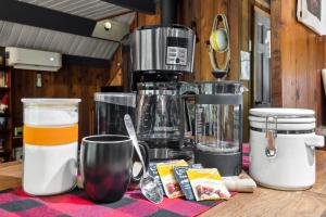 a kitchen counter with a blender and other ingredients at Nisqually Nest at Mount Rainier in Ashford