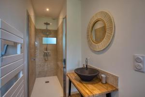 a bathroom with a sink and a shower at Le Pech Eternel - Lodge in Sarlat-la-Canéda +9 photos
