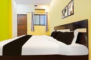 Postel nebo postele na pokoji v ubytování HOTEL O STAR PALACE