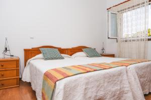 Postel nebo postele na pokoji v ubytování Alojamento Da Cunha + 1 fotografie