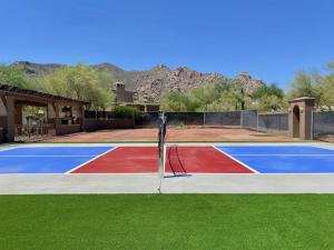 a basketball court with a red white and blue at Chic 3BR Estate with Stables, Pool and Pickleball in Carefree