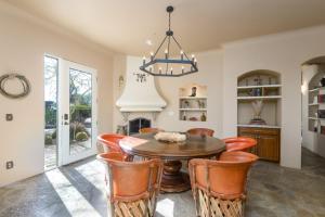 a dining room with a table and chairs at Chic 3BR Estate with Stables, Pool and Pickleball in Carefree +73 photos