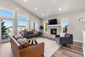 a living room with a couch and a fireplace at Boardwalk in Garden City