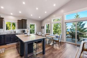 a kitchen and dining room with a table and chairs at Boardwalk in Garden City