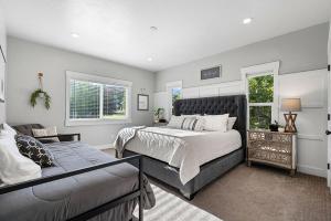 a bedroom with a large bed and a couch at Boardwalk in Garden City +40 photos