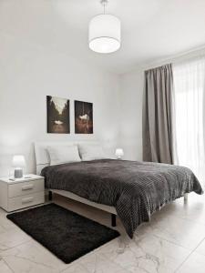 En eller flere senge i et værelse på Seaview Escape