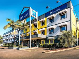 a hotel with a sign on the front of it at ibis Budget - Enfield in Sydney