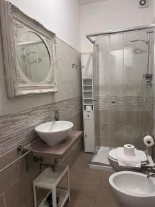 a bathroom with a sink and a glass shower at Appartamenti la Piazzetta vicino a Firenze in Signa +65 photos
