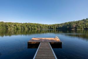 a dock in the middle of a lake at Camp Haliburton - Waterfront A-Frame in Wilberforce