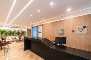 a lobby with a reception desk in a building at Edificio Le Petit - Próx Metrô Vila Mariana in Sao Paulo
