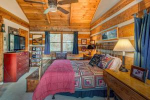 a bedroom with a bed in a room with wooden walls at Scarborough Fair in Banner Elk
