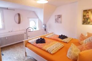 two beds in a room with two bedsvisor at 2 Bed Apt Sleeps 5 - Rooftop Terrace Wifi in Cochem