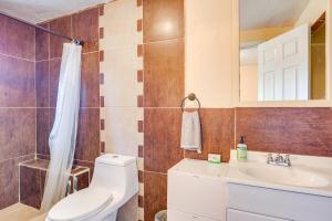 a bathroom with a toilet and a sink at Walk Downtown Authentic Adobe Home in Las Cruces! in Las Cruces +20 photos