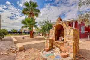 a stone oven in front of a red building at Walk Downtown Authentic Adobe Home in Las Cruces! in Las Cruces