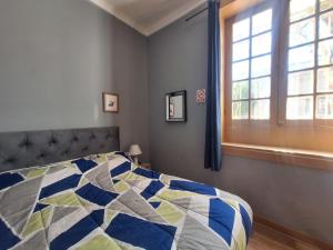 Ένα ή περισσότερα κρεβάτια σε δωμάτιο στο Maravilloso hostal república