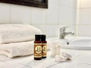 two bottles of essential oils sitting on a bathroom counter at La Bergerie Ouirgane - Serenity Lodge in Asni +55 photos