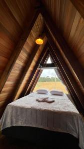 Ένα ή περισσότερα κρεβάτια σε δωμάτιο στο Chalé Pedra Boa