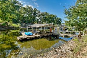 a house on the water with a dock at Lakefront Fun in Sunrise Beach! Pet-Friendly Home! in Sunrise Beach