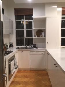 A kitchen or kitchenette at StayCentral - Little Paris CBD Melbourne