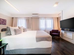 Una cama o camas en una habitación de Mercure São Paulo Ibirapuera Privilege 134 fotos más