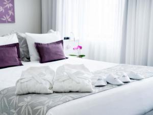 Postel nebo postele na pokoji v ubytování Mercure São Paulo Ibirapuera Privilege