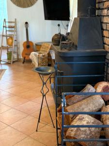 a room with a stove and a stool at Country house in Golan in Kidmat Tsvi