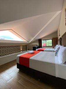 a bedroom with a large bed and a window at Oro Andino Lodge in Caraz +32 photos