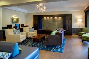 a lobby with couches and chairs and a waiting room at Holiday Inn Express Bellingham by IHG in Bellingham