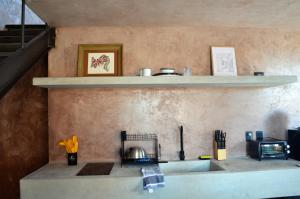 a kitchen with a counter top with a stove at Casa Nacui 1 in El Sargento