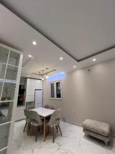 a dining room with a table and chairs at Poppe Home in Domje