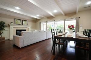 a living room with a couch and a table with chairs at Destination #03 in Fullerton