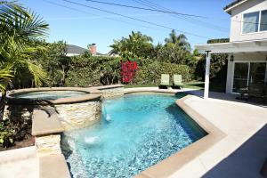 a swimming pool in the backyard of a house at Destination #33 in Orange