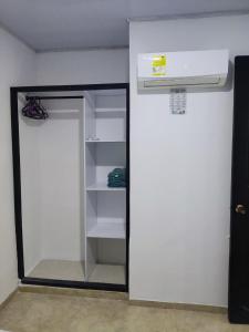 a closet with a mirror and a basketball hoop at Cabaña en condominio frente al mar #10 in Tolú +13 photos